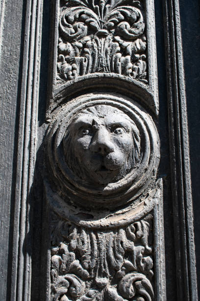 Window, carving and facade of the William Jefferson Clinton Building, Washington D.C..  The building is the headquarters of the Environmental Protect Agency (EPA).  Constructed in 1934, this neoclassical building was designed by William Adams Delano and Chester Holmes Aldrich.   The relief carvings were designed by Adolph Alexander Weinman.