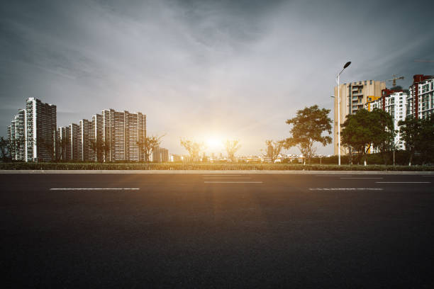 istock Clear sky, urban buildings, roads by dense woods 1263140968