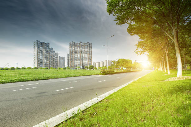 istock Clear sky, urban buildings, roads by dense woods 1263141014