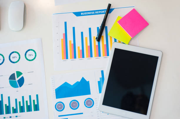 istock Analysis of business report documents with a tablet on the desk. 1263143914