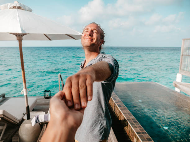 istock Couple holding hands in the Maldives 1263152055