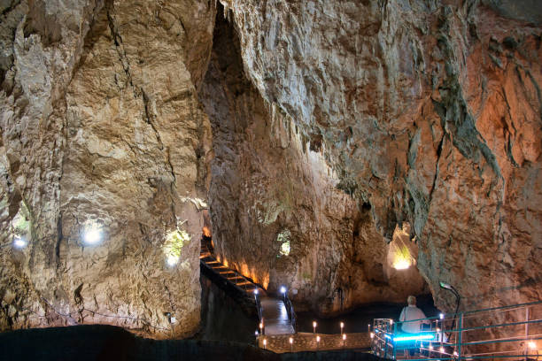 istock Explore the depth inside the Stopica cave - limestone formation with stalactites, stalagmites and water ponds in Zlatibor, Serbia 1263154547
