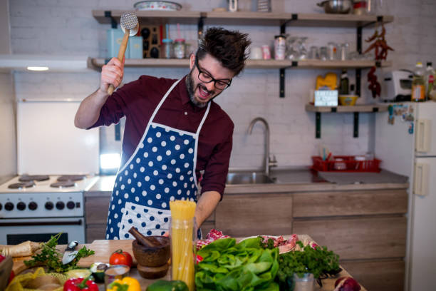 istock Young man cooking healthy meal in the kitchen 1263155402