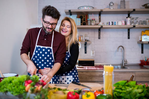 istock Couple preparing food in kitchen 1263155790