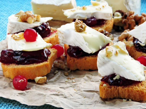 istock Tasty toasts with jam, cheese and seeds. 1263156356