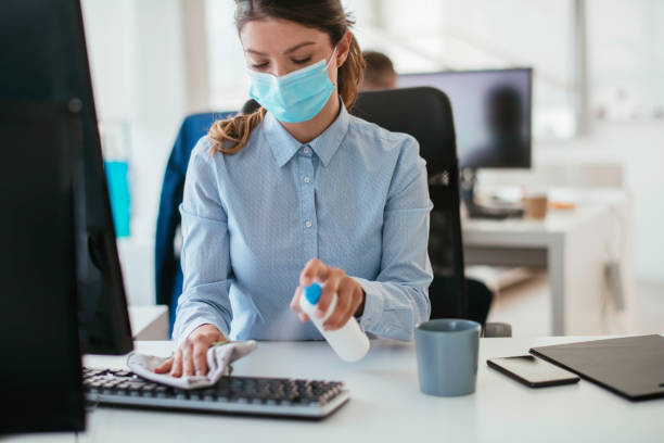 istock Disinfecting her workspace! stock photo 1263161270
