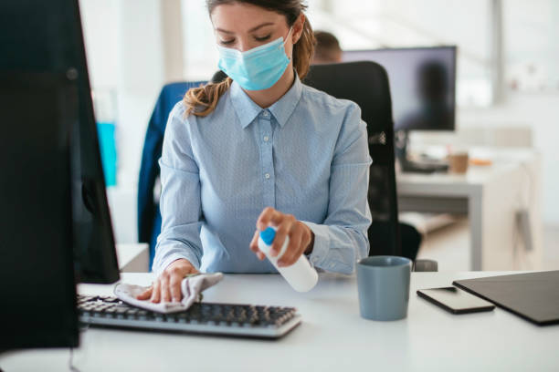 istock Disinfecting her workspace! stock photo 1263161300