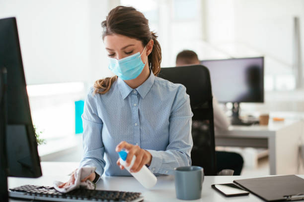 istock Disinfecting her workspace! stock photo 1263161828