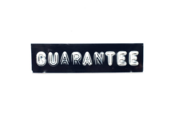 istock Embossed letter in word guarantee on black banner with white background 1263161839