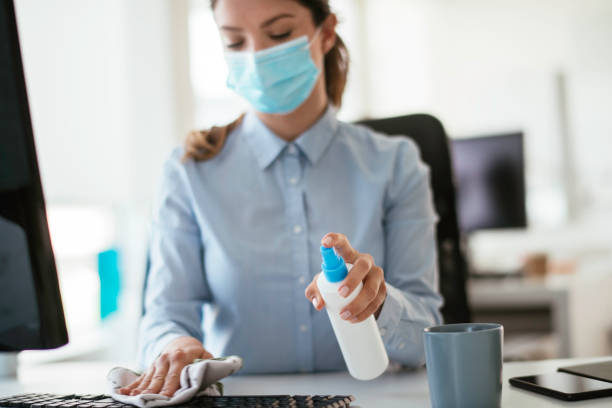 istock Disinfecting her workspace! stock photo 1263161874