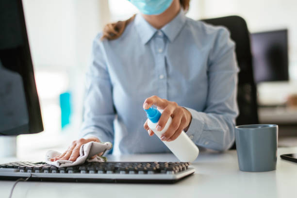 istock Disinfecting her workspace! stock photo 1263161920