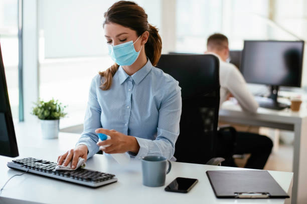istock Disinfecting her workspace! stock photo 1263162211