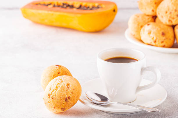 istock Traditional Brazilian breakfast - cheese bread, coffee, ripe fruit, selective focus 1263162238