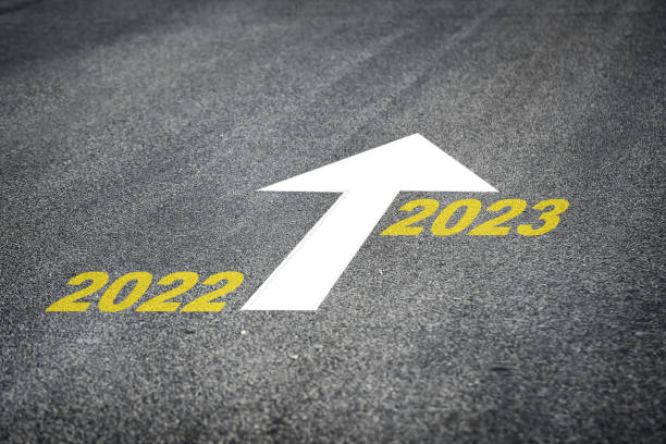 istock Year 2022 to 2023 and white arrow marking on road surface 1263162303