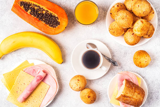 Traditional Brazilian breakfast - cheese bread, coffee, ripe fruit, top view
