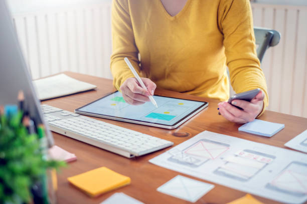istock Young asian woman designer planning develop application develop for mobile phone at home. 1263164055