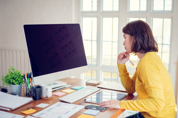 istock Young asian woman designer planning develop application develop for mobile phone at home. 1263164061
