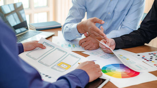 istock Group of designer creativity drawing a website outline and website ux app development on mobile phone. 1263164062