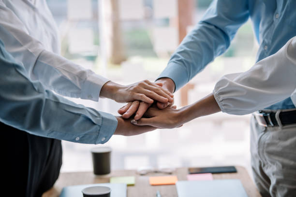 istock Group of business people with unity working together as a team. Teamwork together concept. 1263164132