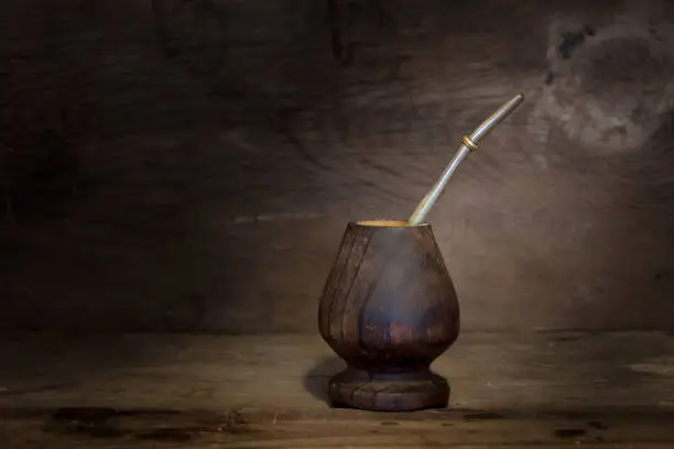 yerbamate and light bulb on rustic wooden background