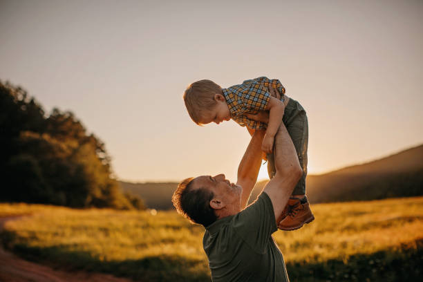 istock Grandfather and grandson enjoying nature 1263166572
