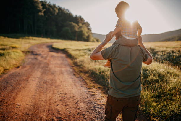 istock Grandfather and grandson enjoying nature 1263166593