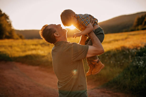 istock Grandfather and grandson enjoying nature 1263166616