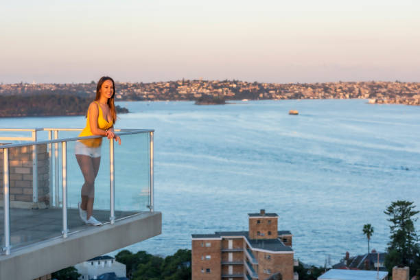 istock Woman enjoying harbour view 1263168394