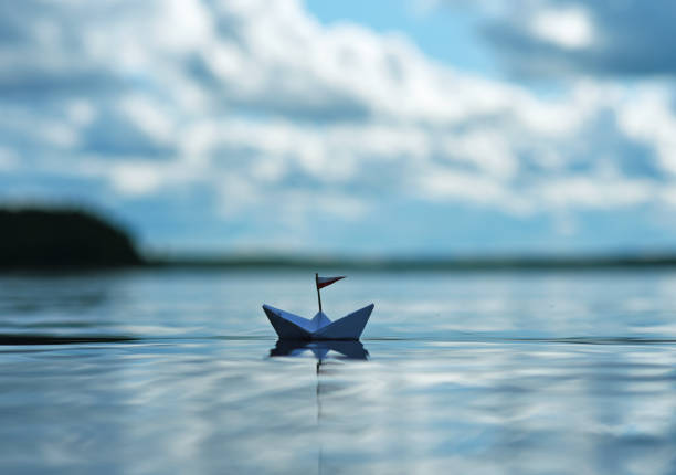 istock Paper Boat on Sunny Sea 1263168905