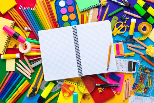 istock School supplies on wooden desk with blank notebook 1263175271