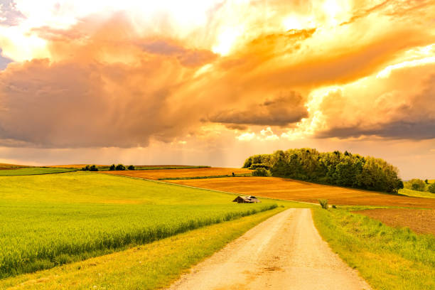 A stormy sky over a idyllic bavarian landscape in southern Germany.