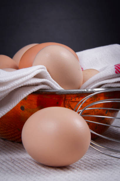 istock Native eggs in a bowl or on a white napkin next to a hand mixer. 1263196395