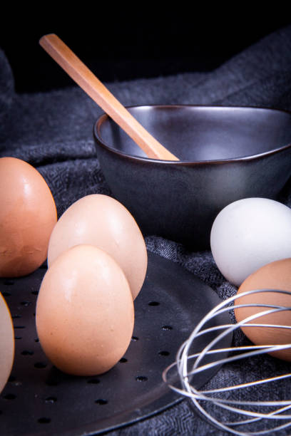 istock Some native eggs are in a wooden basket on a white cloth. 1263196446