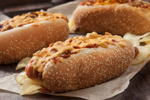 istock Chili Dog with Cheese Sauce and Potato Chips 1263201294