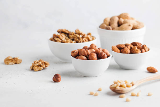 istock Assorted nuts. The dried nuts, hazelnuts, almonds, walnuts and others. Healthy food, healthy snacks. Copy space. 1263214594