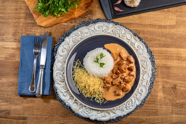 istock Chicken stroganoff with rice and potato straw. 1263214754
