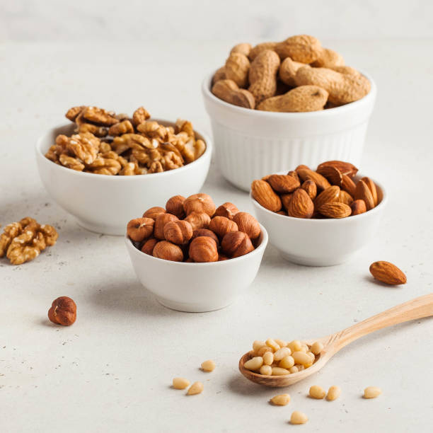 istock Assorted nuts. The dried nuts, hazelnuts, almonds, walnuts and others. Healthy food, healthy snacks. Copy space. 1263223790