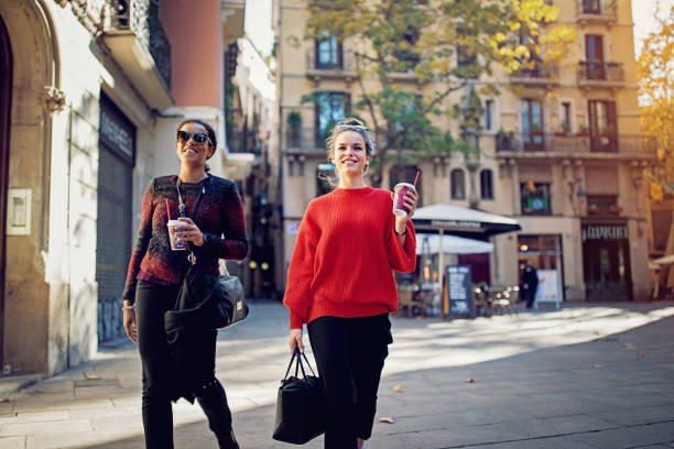 istock Girlfriends are walking and exploring the gothic quarther 1263224303