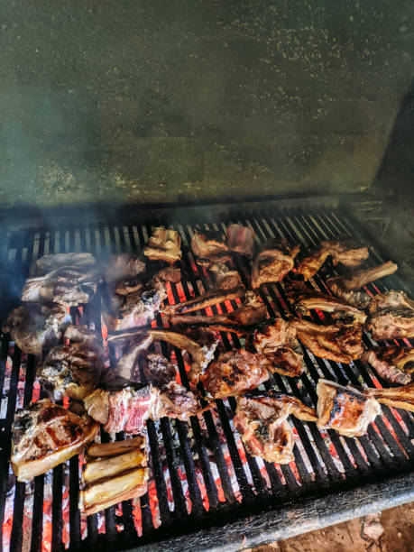 istock Grilled lamb ribs. Large metal grate with hot coals. 1263227586
