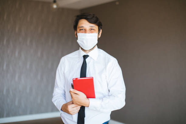 istock Real Estate Agent with a protective face mask 1263227698
