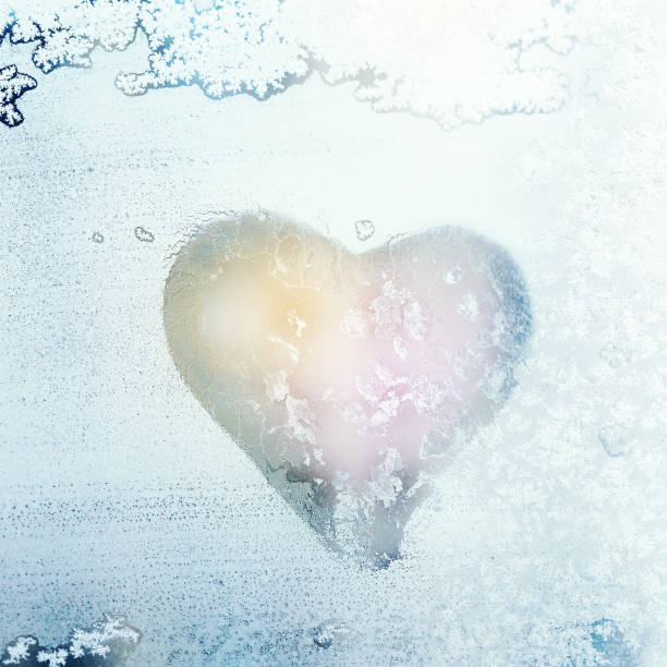 istock Heart shape symbol on Frozen window glass 1263227764