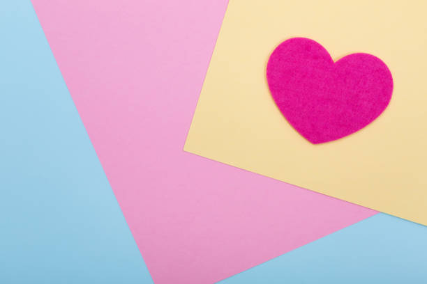 istock Heart shape on serenity colored paper texture 1263229003