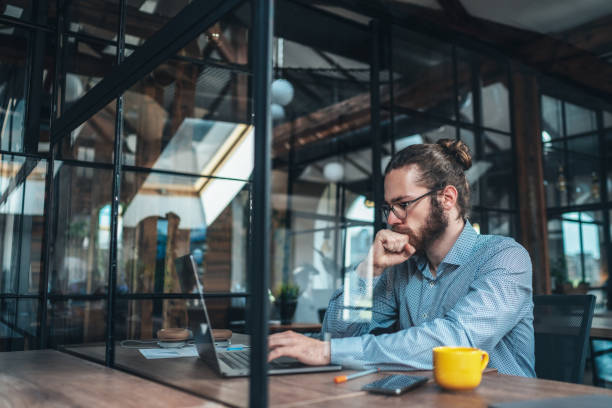 istock Young businessman working at office 1263232929