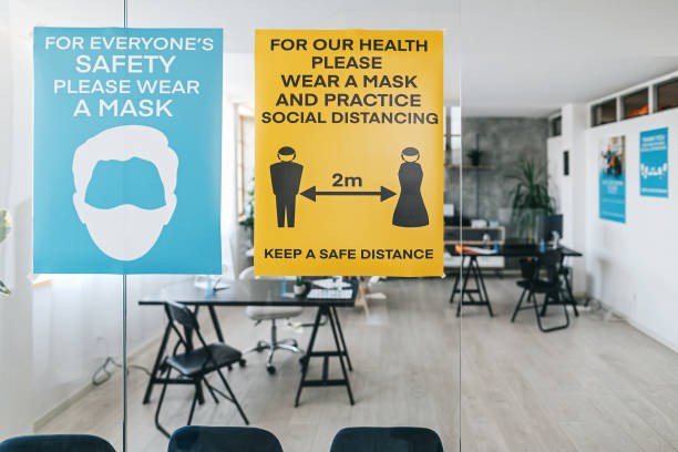 istock Social distancing and coronavirus prevention message at bank 1263233691