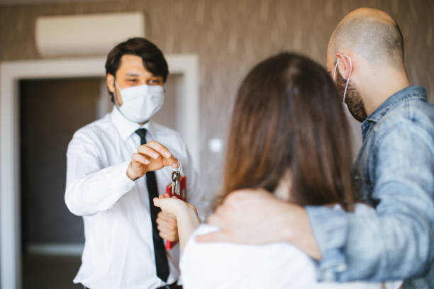 istock Real Estate Agent with a protective face mask 1263234011