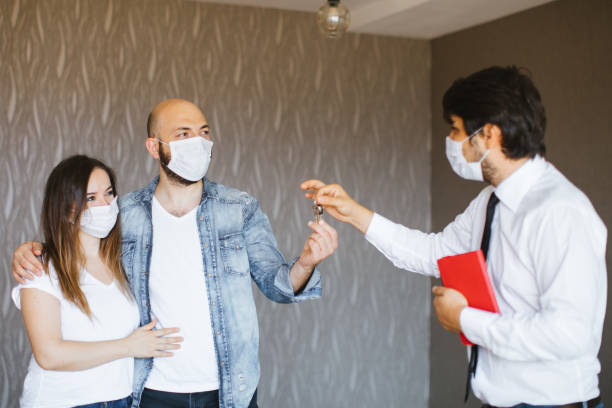 istock Real Estate Agent with a protective face mask 1263234116