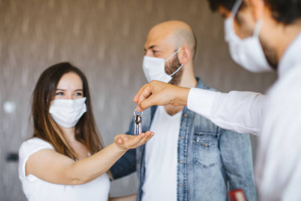 istock Real Estate Agent with a protective face mask 1263235361