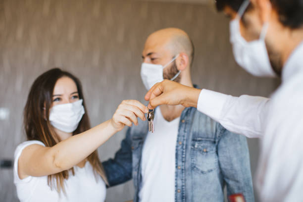 istock Real Estate Agent with a protective face mask 1263236874