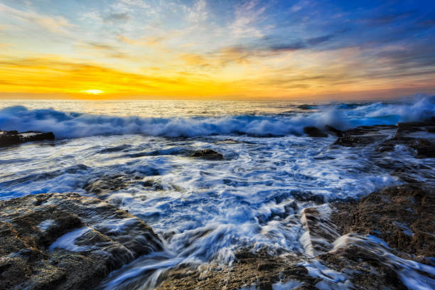 istock Sea TB rocks dawn small wave 1263242304