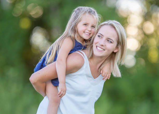 istock Mother and daughter outside 1263245752